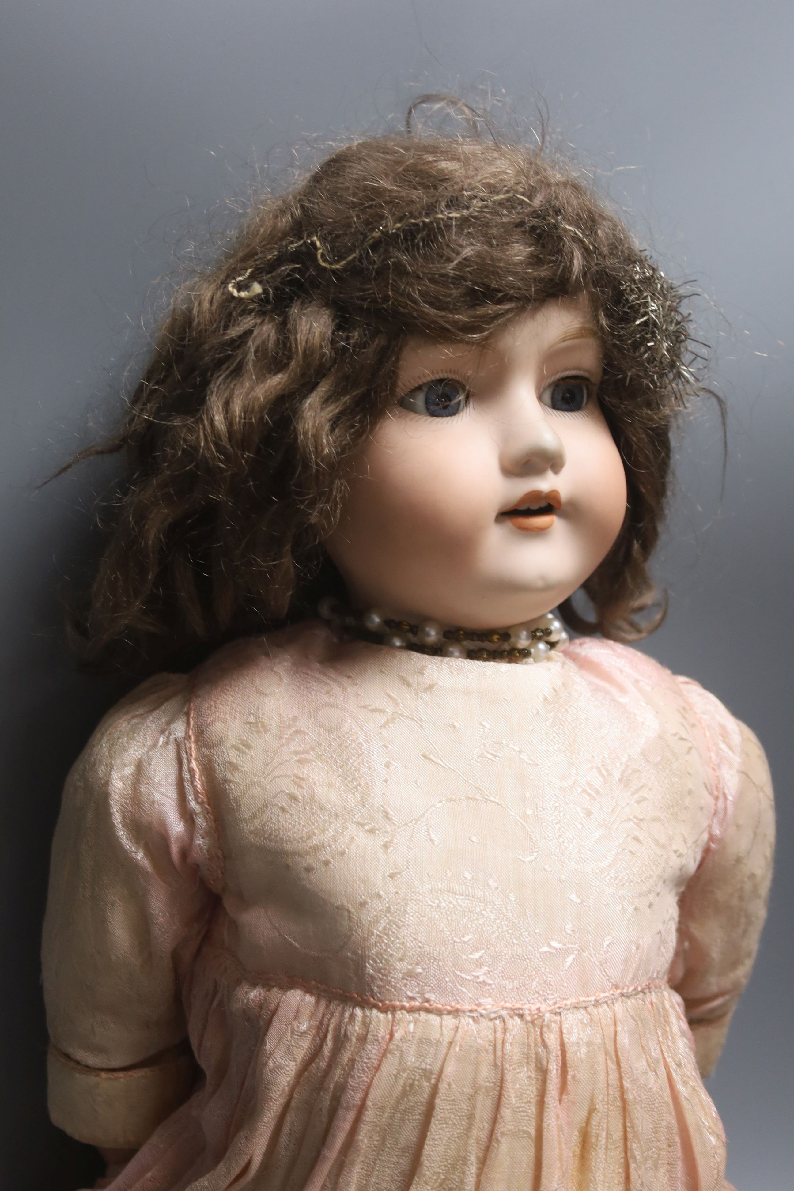 An Armand Marseille bisque headed doll